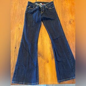 Lucky Low-rise button front bootcut jeans.